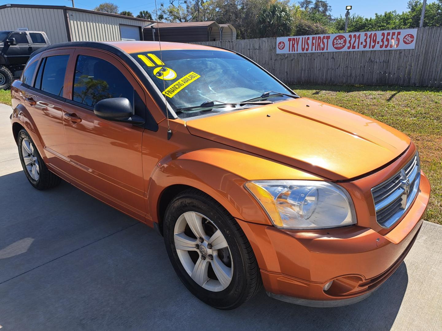 2011 ORANGE Dodge Caliber Mainstreet (1B3CB3HA2BD) with an 2.0L L4 DOHC 16V engine, Continuously Variable Transmission transmission, located at 1181 Aurora Rd, Melbourne, FL, 32935, (321) 241-1100, 28.132914, -80.639175 - Photo#1